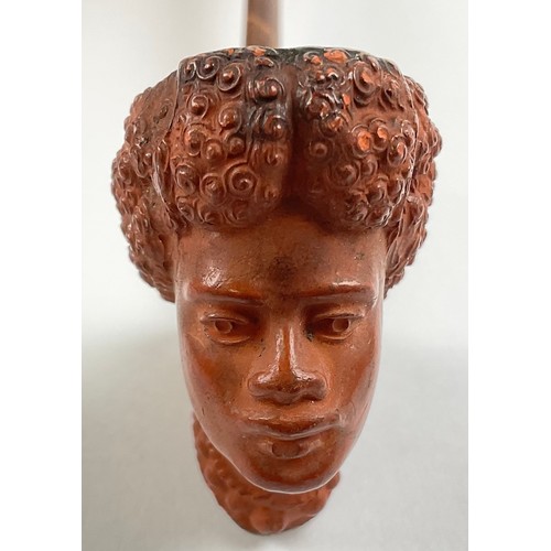 3020 - A French Orientalist figural pipe, the terracotta clay bowl modelleed as the head of a Nubian lady, ... 