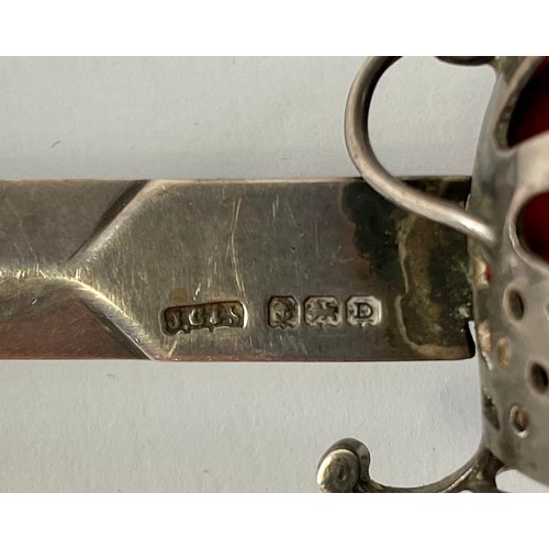 3056 - A George V silver novelty paper knife, as a Scottish officer's sword of the Highland light infantry,... 