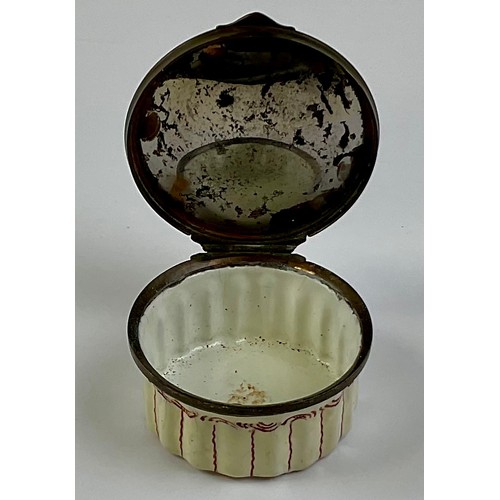 3054 - A George III Staffordshire enamel patch box, as a dog basket, the hinged cover cast with a spaniel, ... 