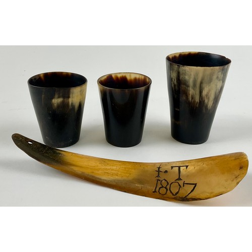 3029 - A George III cattle horn shoe horn, scrimshaw engraved with initials IT and dated 1807, 19.5cm long;... 