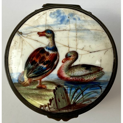 3032 - A George III South Staffordshire enamel and brass mounted circular snuff box, the hinged cover paint... 