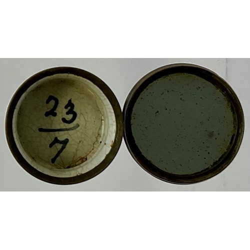 3044 - A George III South Staffordshire enamel and copper mounted patch box, the press close cover painted ... 