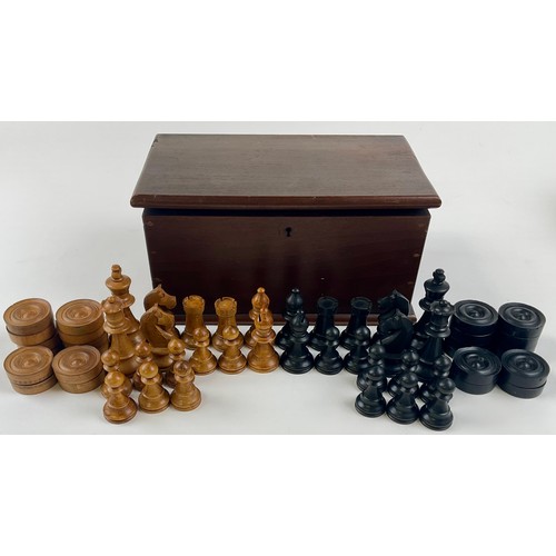3010 - A boxwood and ebonised Staunton pattern chess set, the Kings 8cm high; a set of draughts, similar; t... 