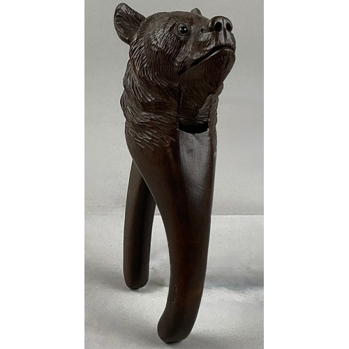 3001 - A Black Forest novelty lever-action nut cracker, carved as the head of a bear, glass eyes, 20.5cm lo... 