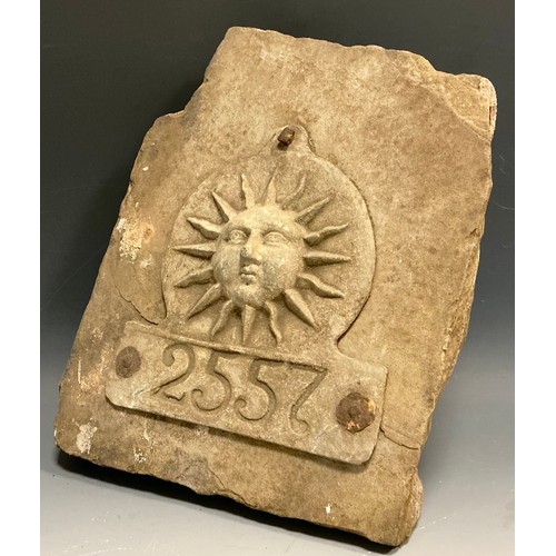 5004 - A lead The Sun Fire Office fire mark / plaque numbered 2557, mounted on a dressed gritstone slab, 29... 