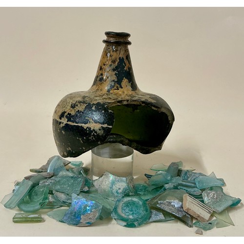 5000 - A late 17th/ early 18th century green glass onion bottle fragment, mottled brown patina; a collectio... 