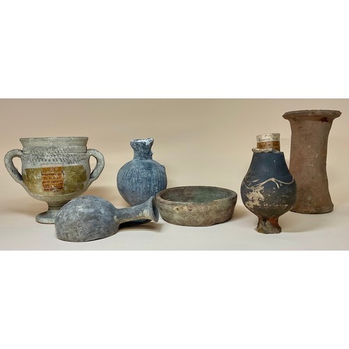 5058 - Antiquities - a small Romano-British Castor ware baluster shaped specimen vase, label to base readin... 