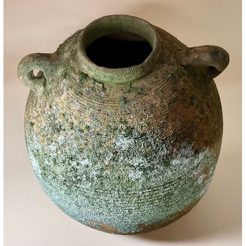 5029 - A ‘Graeco-Roman’ Palestinian bag-jar amphora of globular ribbed form twin loop carrying handles, 36c... 