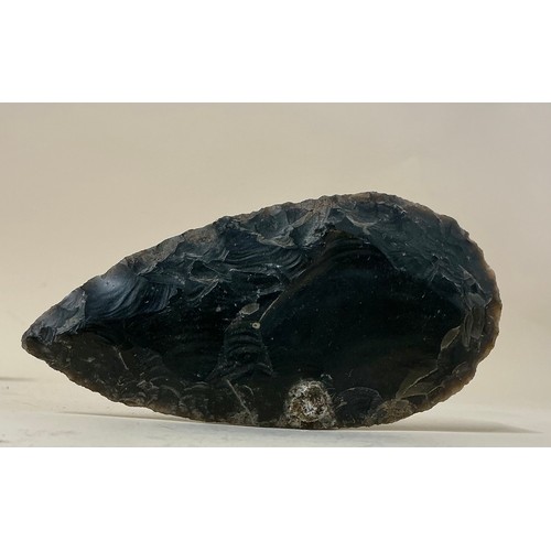 5035 - A collection of Neolithic pressure flaked and knapped flint hand tools and weapons including a leaf ... 