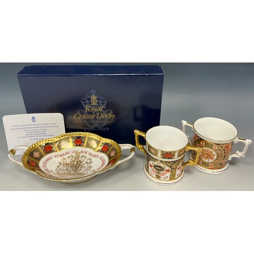 29 - Royal Crown Derby - an 1128 patten old Imari loving cup;  and a ‘With Love’ Millennium 2000 loving c... 