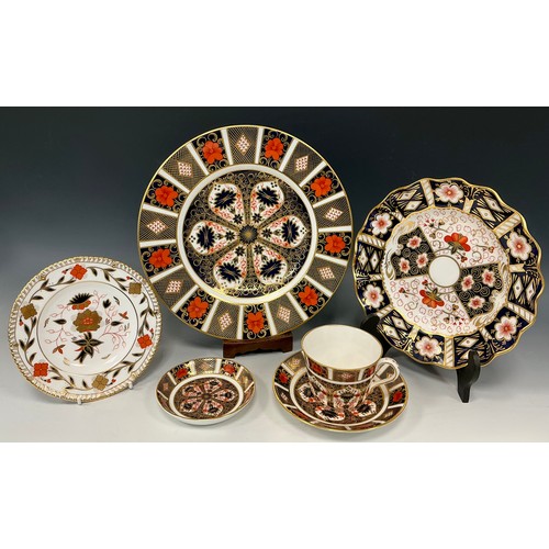 30 - A Royal Crown Derby Old Imari 1128 pattern plate, 27cm diameter;  1128 pattern cup and saucer, and a... 