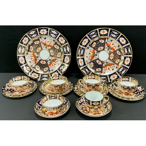 31 - Royal Crown Derby - Imari pattern 2451 pair of plates, five tea cups, six saucers, four tea plates, ... 