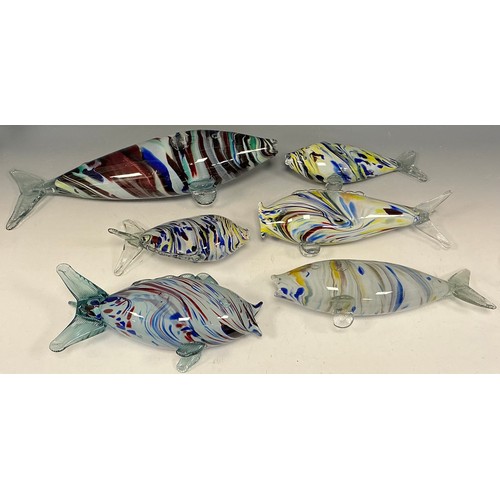 40 - A collection of 1970s and later Murano Glass Fish, with bands and swirls of multi-colours, the large... 