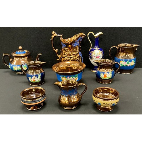 45 - A copper lusterware teapot, jug and sugar bowl with moulded floral decoration to central blue band; ... 
