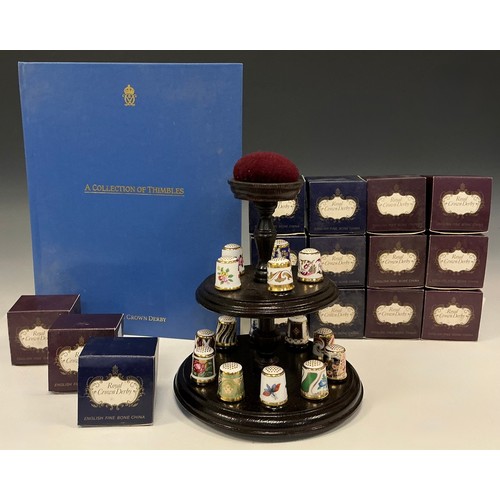 47 - A complete collection of fifteen Royal Crown Derby thimbles including, Art nouveau, Purple scroll, B... 