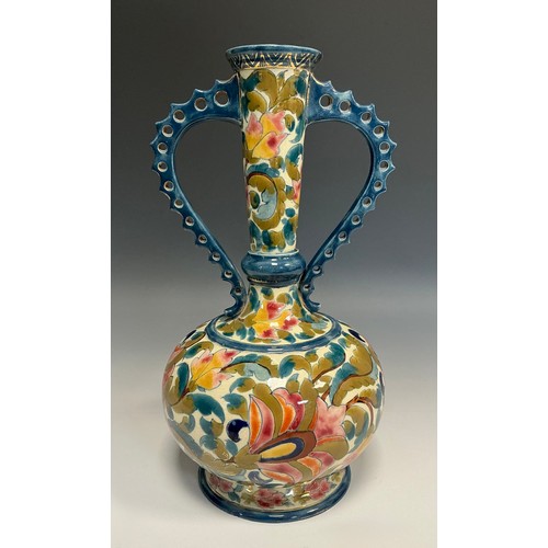 53 - A Hungarian Fischer J Budapest compressed ovoid vase, reticulated handles, brightly painted with flo... 
