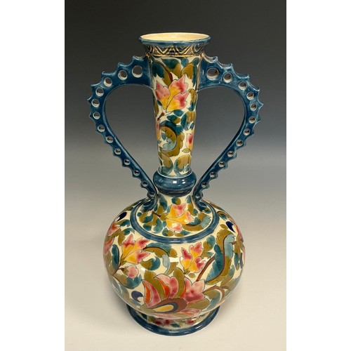 53 - A Hungarian Fischer J Budapest compressed ovoid vase, reticulated handles, brightly painted with flo... 