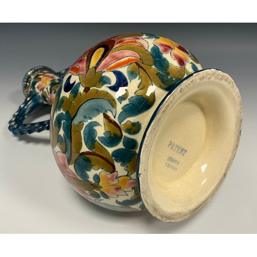 53 - A Hungarian Fischer J Budapest compressed ovoid vase, reticulated handles, brightly painted with flo... 
