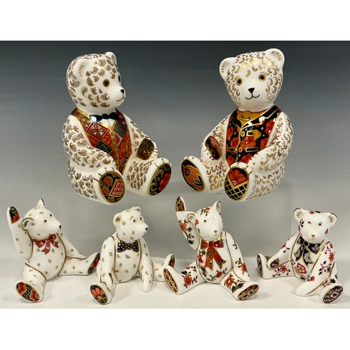 24 - Royal Crown Derby Paperweights - Two large Seated Teddy Bears, gold stopper;  and a group of four sm... 
