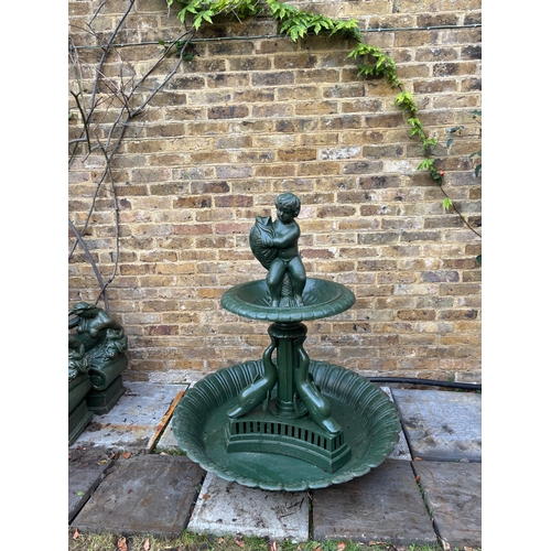 4011 - A delightful classical two-tier cast iron garden fountain, of a medium size, the finial is a seated ... 