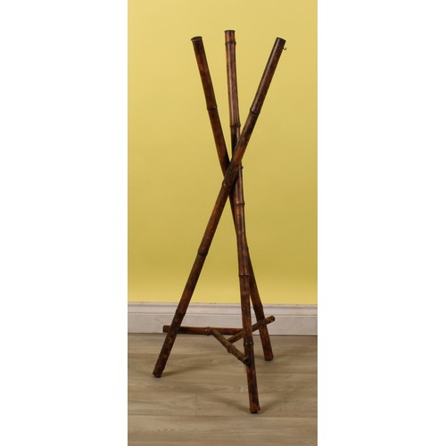 47 - An Aesthetic Movement bamboo jardiniere or plant stand, each support terminating with a hanging hook... 