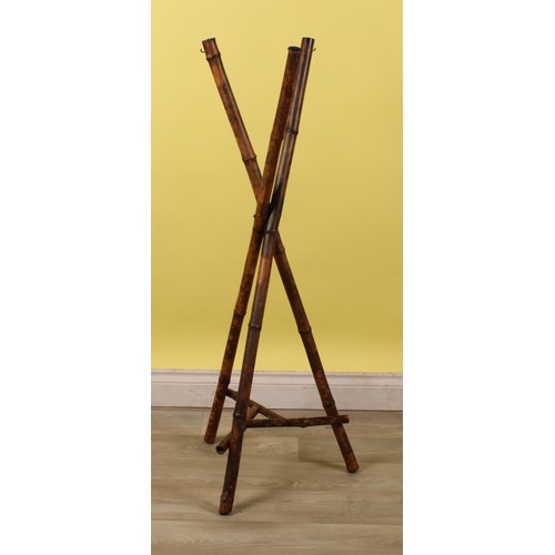 47 - An Aesthetic Movement bamboo jardiniere or plant stand, each support terminating with a hanging hook... 