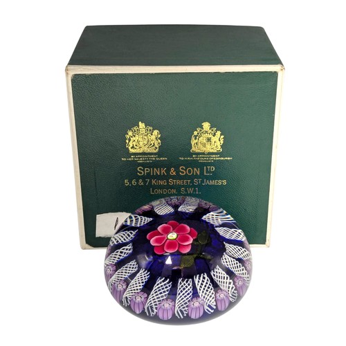 29 - A 20th century glass paperweight, in the style of Paul Ysart (1904-1991), flower head inclusion with... 