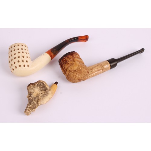 42 - A 19th century Meerschaum pipe, the bowl carved with the head of a Russian man, leather case; others... 