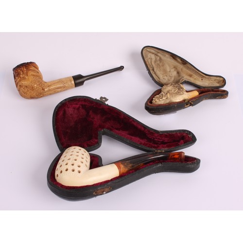 42 - A 19th century Meerschaum pipe, the bowl carved with the head of a Russian man, leather case; others... 