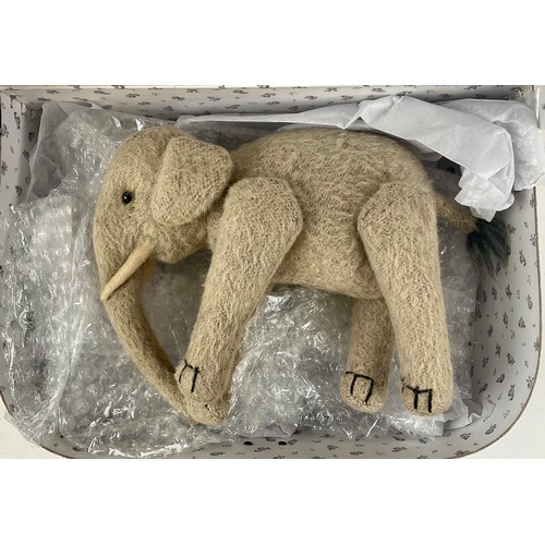 3037 - An early 20th century burlap plush jointed elephant, probably Steiff, boot button eyes, 15.5cm high,... 