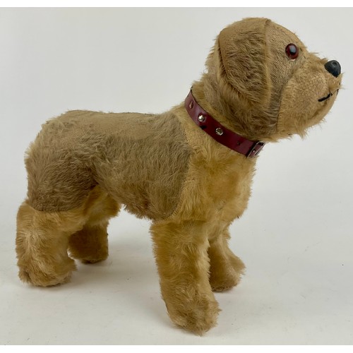 3047 - A large 1950’s freestanding mohair Terrier, dark amber eyes, celluloid nose with stitched mouth, sta... 