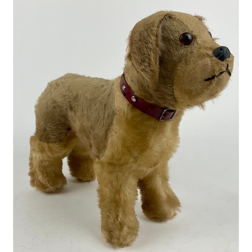 3047 - A large 1950’s freestanding mohair Terrier, dark amber eyes, celluloid nose with stitched mouth, sta... 