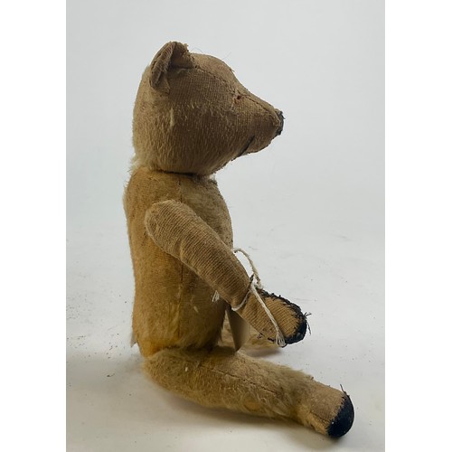 3051 - A well-loved early 20th century blonde mohair jointed bear, straw filled, slightly humped back, stit... 