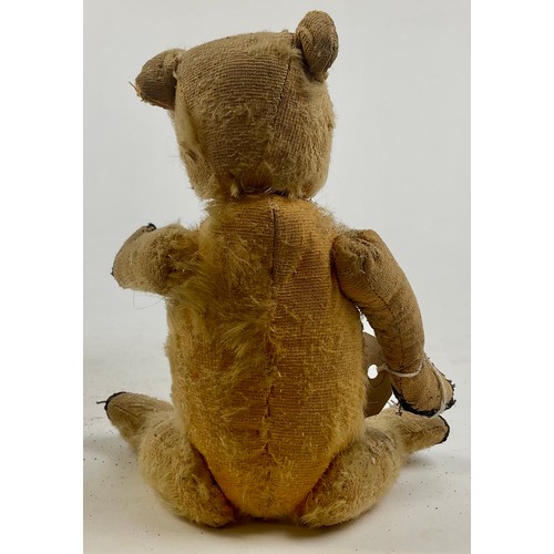 3051 - A well-loved early 20th century blonde mohair jointed bear, straw filled, slightly humped back, stit... 