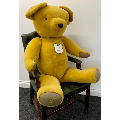 3055 - A very large plush freestanding teddy-bear by Merrythought, with jointed shoulders and legs, 120cm