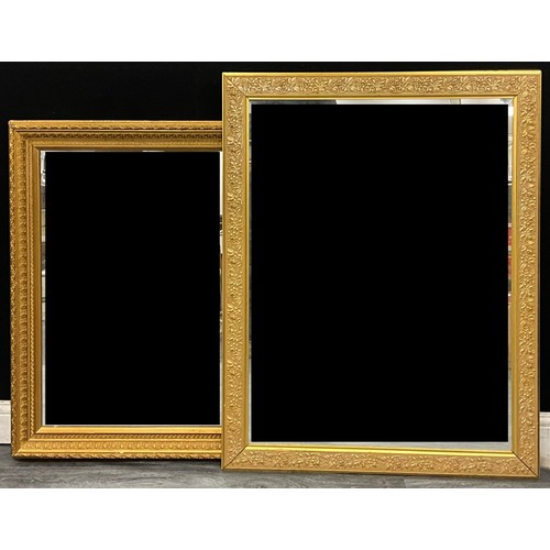 A giltwood rectangular looking glass, the frame with borders of Greek ...