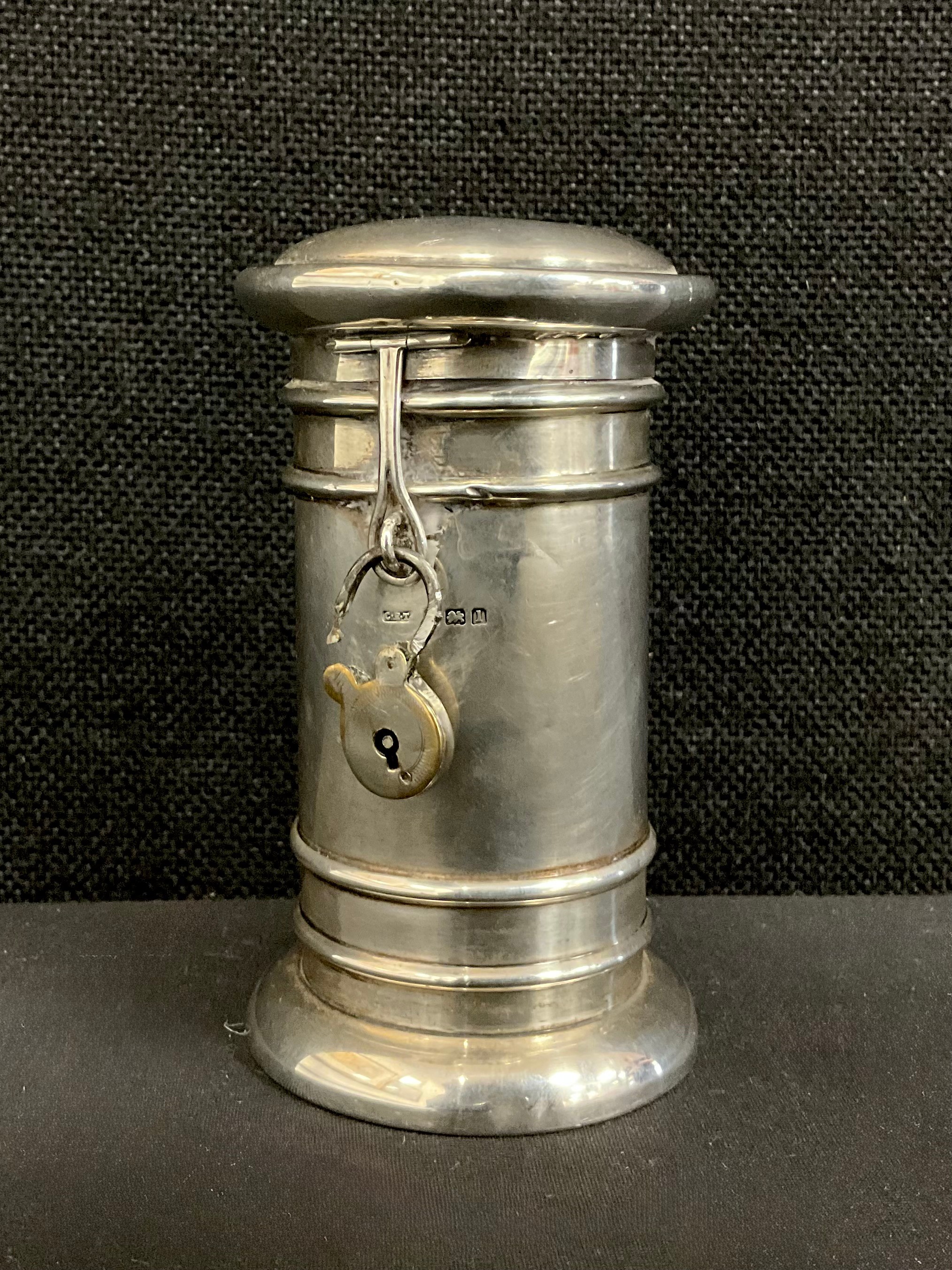An Edwardian silver novelty coin bank, as a post box, cylindrical body ...