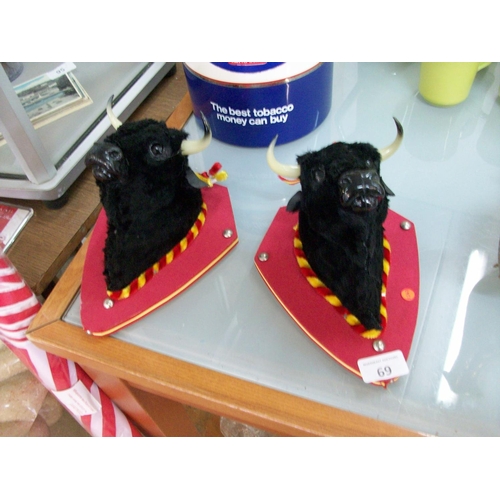 69 - 2 Small Bull Wall Hangings