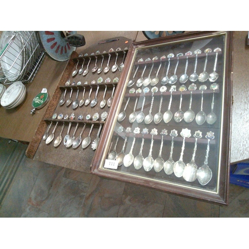 111 - 2 Sets of Spoons on Display Racks