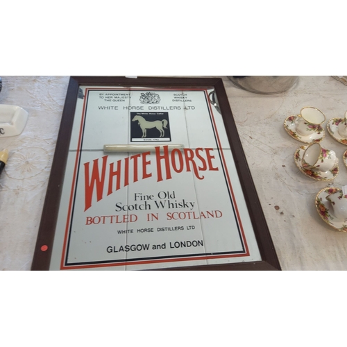 178 - Vintage White Horse Scotch Whisky mirror with wooden frame. Measures approximately 20 x 26 inches.