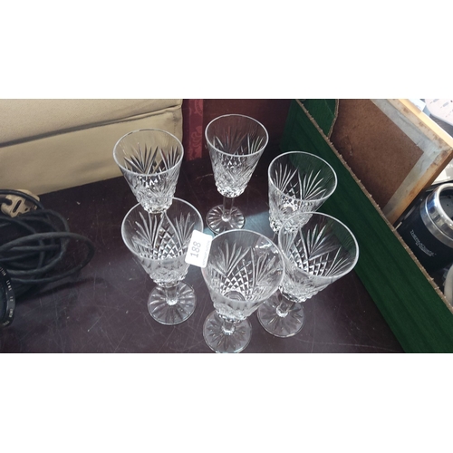 188 - Set of six crystal wine glasses with intricate cut glass patterns. Each glass showcases a distinctiv... 