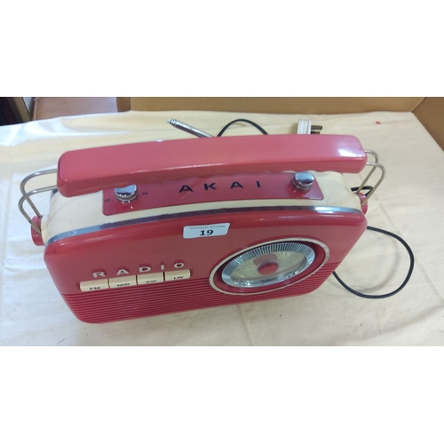 19 - Vintage Akai portable radio in retro red and cream design. It features FM, MW, SW, and LW bands with... 