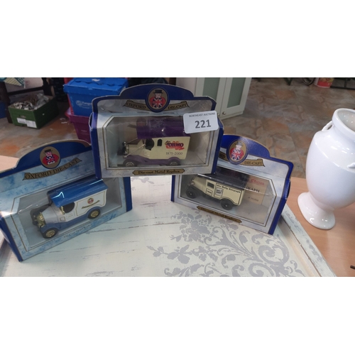 221 - Set of three Oxford Diecast metal replica vintage delivery trucks in original packaging. Models adve... 