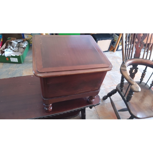 296 - Antique wooden commode with porcelain chamber pot. Features rich mahogany finish, hinged lid, and tu... 