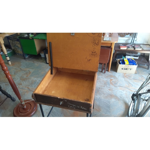 299 - Vintage wooden school desk with hinged top storage compartment and metal legs. Has handwritten notes... 