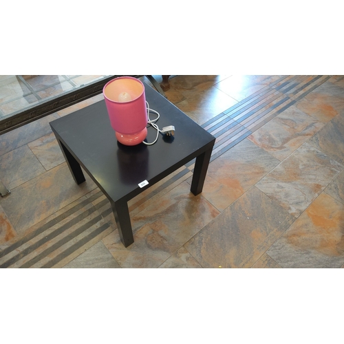 305 - Black wooden side table with a pink table lamp featuring a fabric shade. Includes an attached power ... 