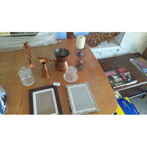 324 - Mixed lot comprising 2 copper jugs, glass jars, candlestick holders, and 2 picture frames. 3 books: ... 