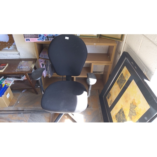 349 - Black fabric swivel office chair with armrests.