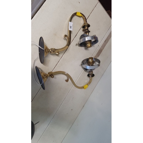 36 - Pair of vintage brass wall lights with curved arms and candle-style bulb holders.