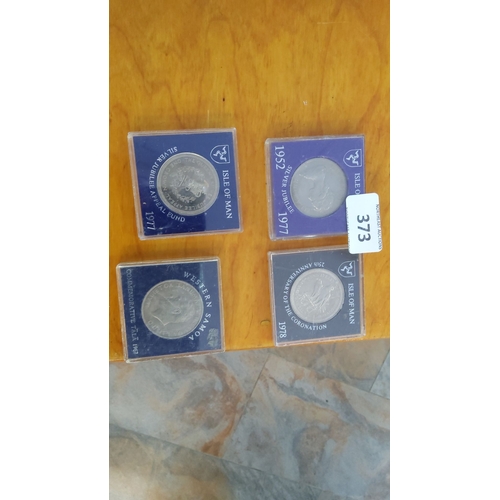 373 - Four commemorative coins. The set includes a 1977 Isle of Man Silver Jubilee coin, a 1977 Silver Jub... 